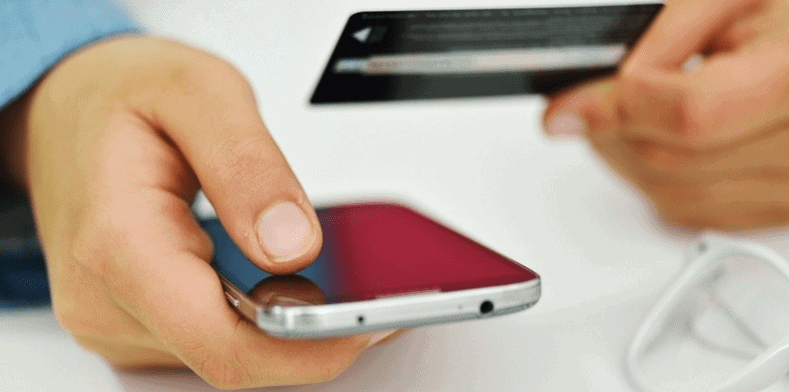 close up of hand holding mobile phone