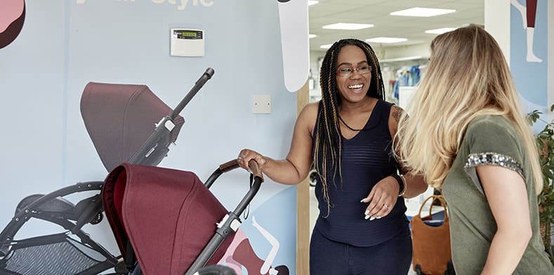 Women with pram at retail event