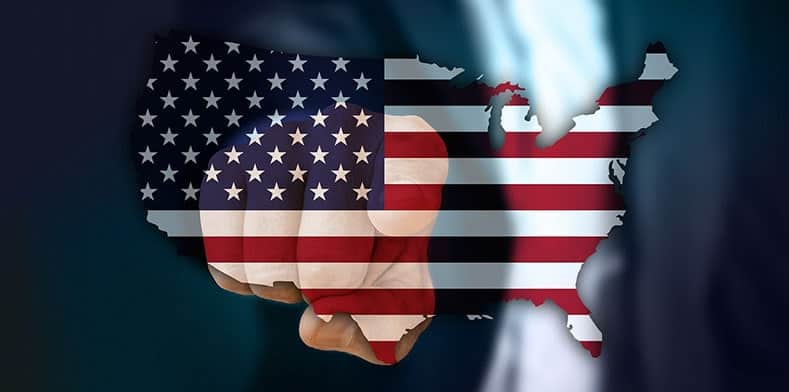 Main in suit pointing with US flag superimposed