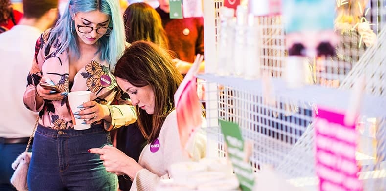 People look at phones in store