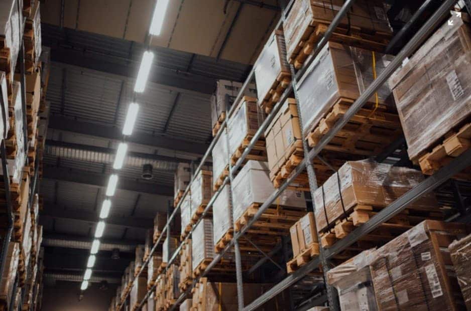 warehouse shelves with boxes on pallets