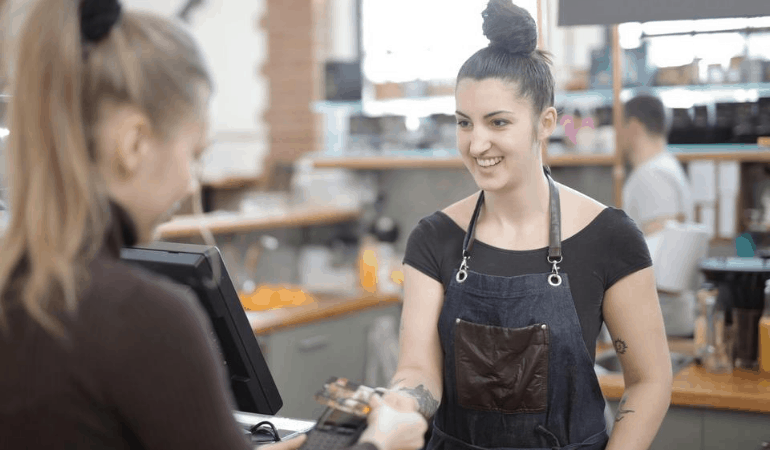 Woman at checkout in store