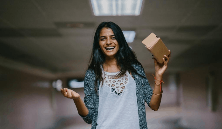 Smiling woman with package