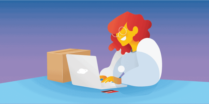 Person working on laptop with cardboard box