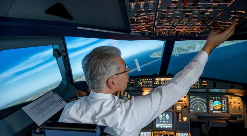 Pilot in cockpit of passenger aircraft