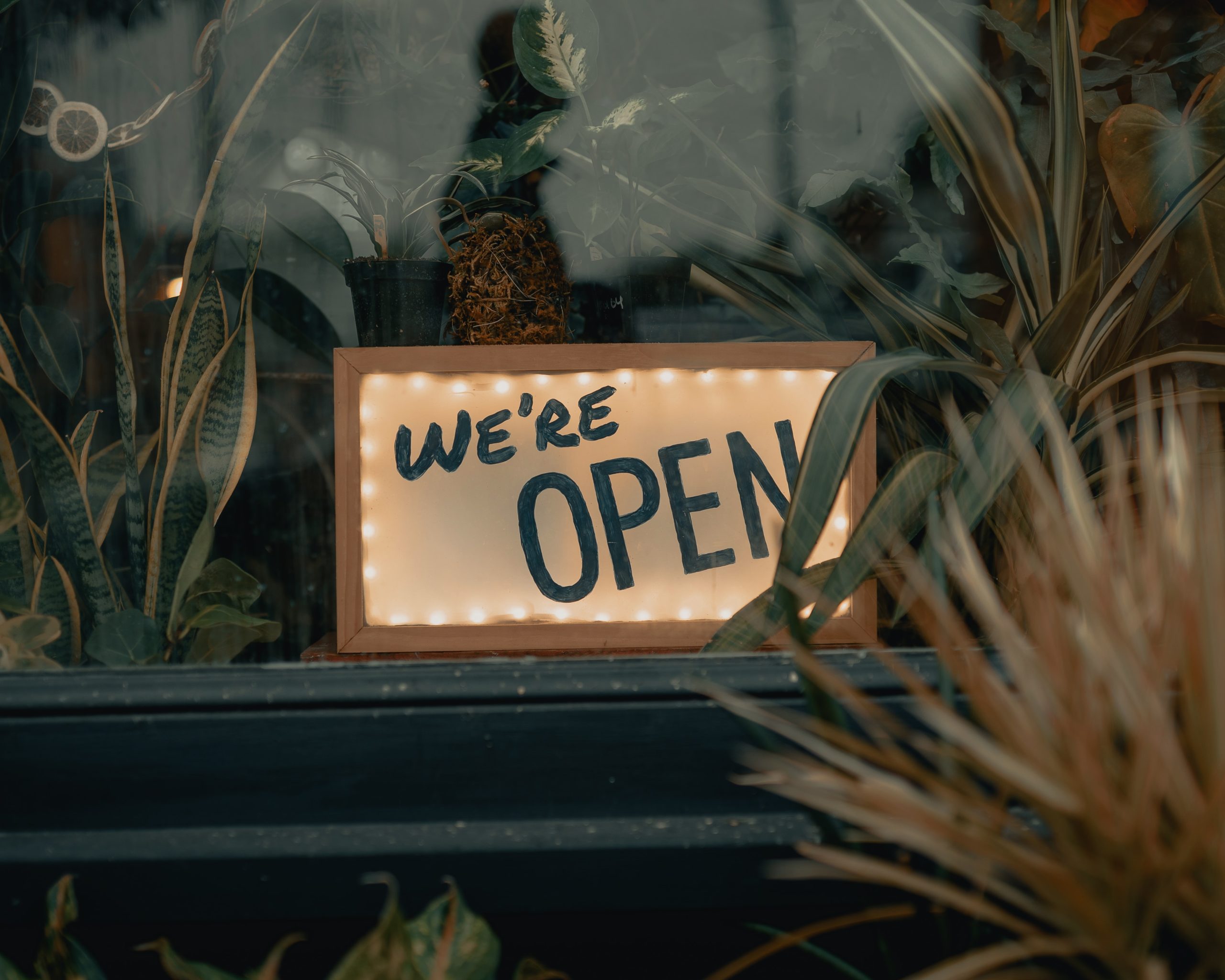 Were open sign in store window