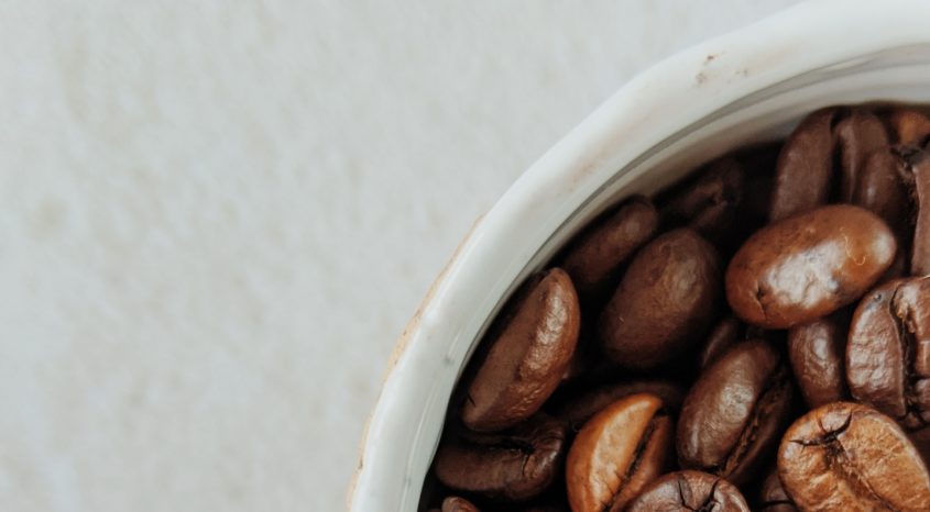 Coffee beans in a cup
