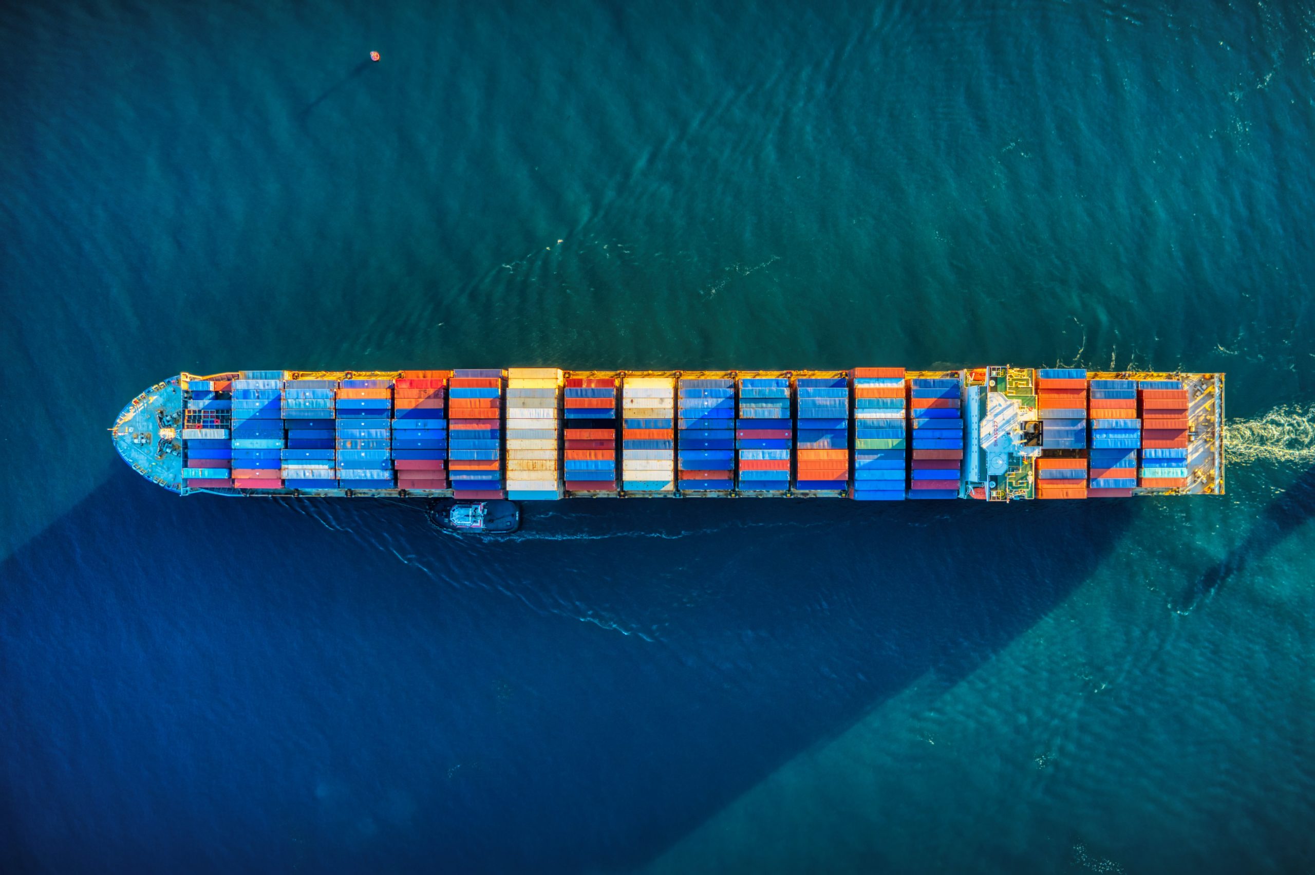 Arial photo of ship at sea with containers on deck