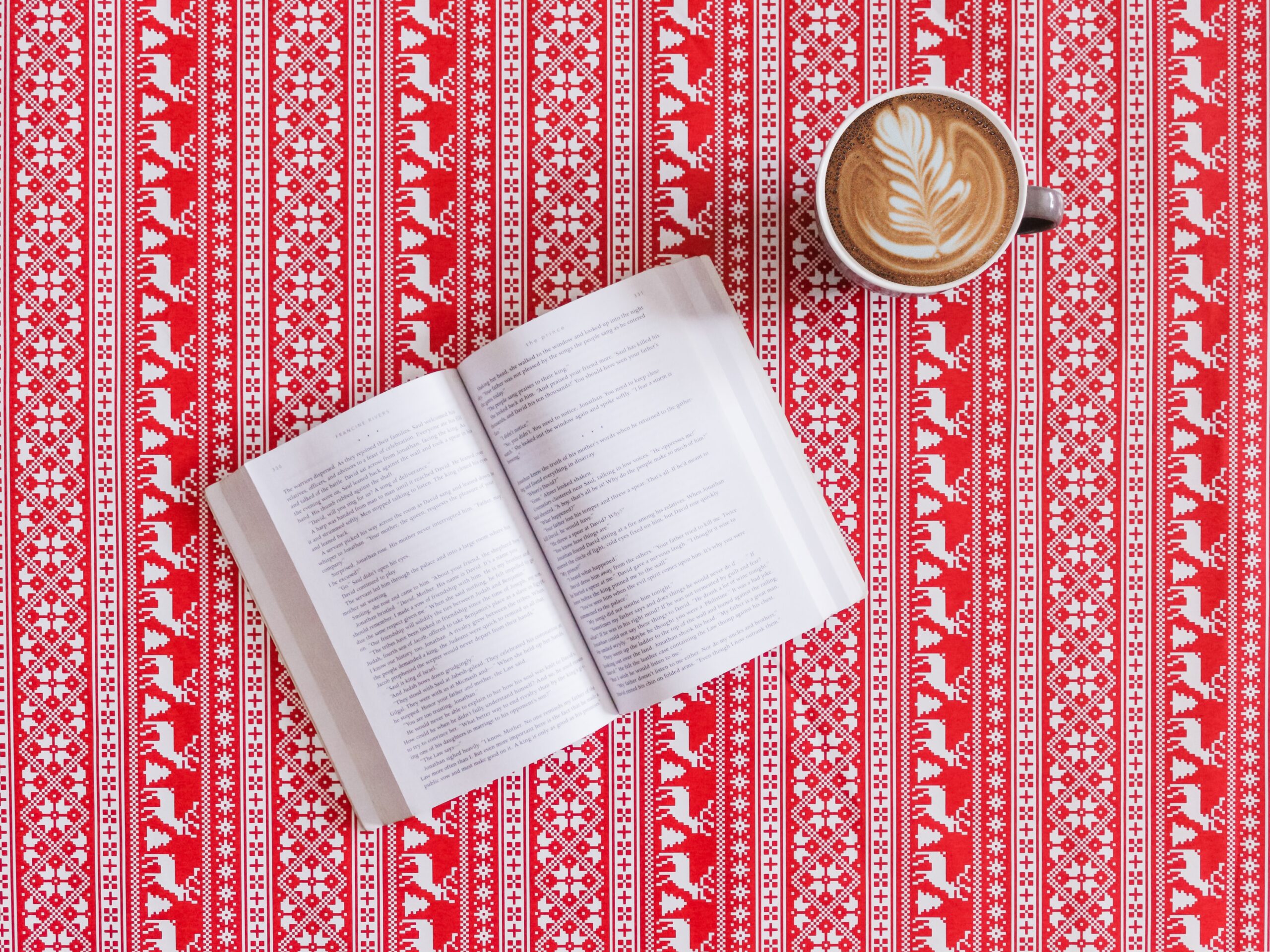 Open book with cup of coffee
