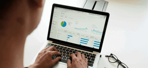 Men looking data on a laptop